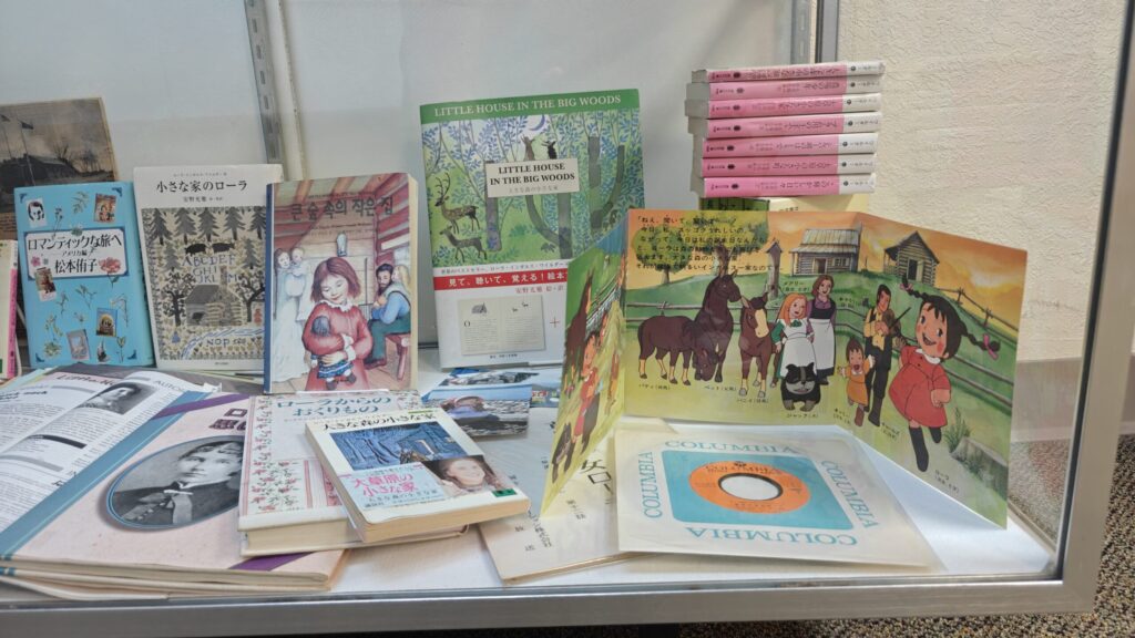Japanese translations of the Little House books in the Pepin museum, alongside a 45 RPM record form the anime